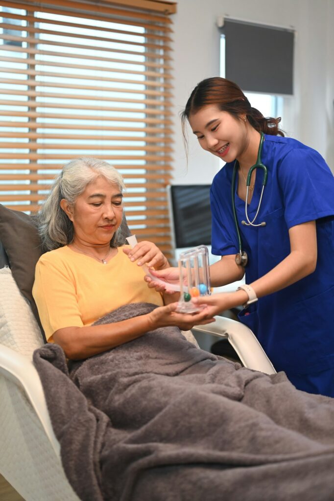 Physical therapist using Incentive Spirometer to help patients to improve the functioning of lungs